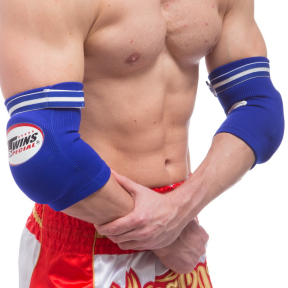 Налокотники спортивные с фиксирующим ремнем и амортизирующей вставкой TWINS EGN1 S-L 2шт цвета в ассортименте